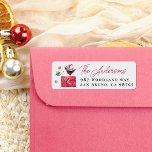 Watercolor Christmas Bird & Gift Return Address Label<br><div class="desc">A cute Christmas design with a hand-drawn bird wearing a Christmas hat sat on top of a red gift. There are hand-drawn stars and dots around the bird. On the right, your family name is written in modern script lettering, with your home address printed below. View the collection linked on...</div>