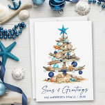 Watercolor Coastal Tree Seas and Greetings Beach Holiday Card<br><div class="desc">Modern Minimalist Elegance Calligraphy Ink Pen Handwritten Script Seas & Greetings Coastal Holiday Card includes a Watercolor Christmas Tree make of beach ocean driftwood,  seashells,  sand dollars,  nautical anchor ornament and topped with a starfish. Navy Blue Text.</div>