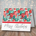 Watercolor Festive Red Green Christmas Holiday Card<br><div class="desc">A festive and fun Christmas card featuring a colourful watercolor presents pattern in classic green and red with hints of blue on both the front and back. The text "Merry Christmas" is elegantly scripted at the bottom, along with your family name or business name. This design is perfect for spreading...</div>