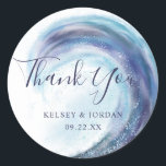 Watercolor Ocean Wave Wedding Thank You Favour Classic Round Sticker<br><div class="desc">These beautiful wedding favour stickers feature a hand painted ocean wave in various hues of blue,   purple,  aqua / teal,  black,  and grey. Easy to personalise for your special day! For custom design or product requests,  please contact me (Tracey) at orabellaprints@outlook.com.</div>