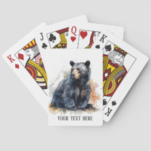 Watercolor painting of a sitting black bear playing cards