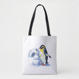 Watercolor Penguin building a snowmen Tote Bag