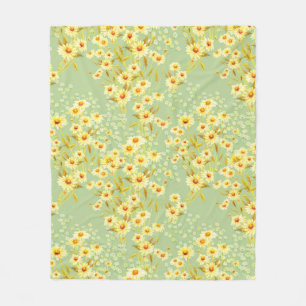 Watercolor picture of daisy flowers on a light gre fleece blanket