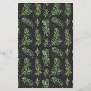 Watercolor pine branches on black background.