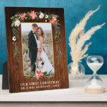 Watercolor Poinsettia Wood Our First Christmas  Plaque<br><div class="desc">Elegant Watercolor Poinsettias Our First Christmas Newlywed Wedding Photo Plaque includes beautiful watercolor red poinsettias,  botanical greenery,  winter foliage,  holly berries,  white roses,  cotton,  pine cones and blue berries.  Gold Frame. Rustic Country Wood Print.</div>
