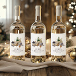 Watercolor Rustic Gnome Merry Christmas Wine Label<br><div class="desc">These cosy, rustic holiday wine labels feature a watercolor illustration of a cute female gnome seated next to a miniature Christmas tree, a basket of birch logs, and some candles. The words "MERRY CHRISTMAS" appear in grey serif letters that coordinate with the art. Add your family's name in charcoal grey...</div>