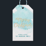 Watercolor Turquoise Blue Water Christmas Gold Gift Tags<br><div class="desc">Lovely modern watercolor blue aqua turquoise water beach colours with faux glitter Merry Christmas in script letters. Personalise them by adding family name. Perfect for envelopes,  cards,  invitations,  gifts,  favours... .</div>