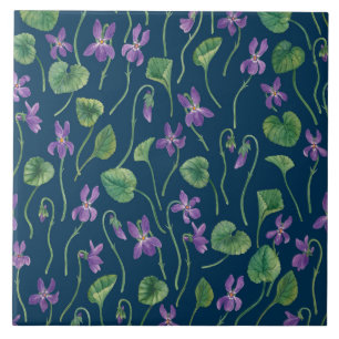 Watercolor violets on blue ceramic tile