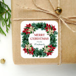 Watercolor Winter Floral Wreath Merry Christmas Square Sticker<br><div class="desc">This personalised holiday sticker features a lush watercolor floral wreath of red and ivory poinsettia flowers with winter greenery. The words "Merry Christmas" appear in dark red serif font. Personalise the design with your family name below in green italics.</div>