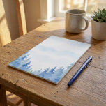 Watercolor Winter Forest Blue Nature notepad<br><div class="desc">Add a touch of serene beauty to your notes with this watercolor winter forest stationery. Featuring delicate blue and green pine trees against a frosty white background,  this unlined paper design is perfect for letters,  journalling,  or seasonal correspondence. Ideal for nature lovers,  winter-themed events,  and rustic stationery collections.</div>