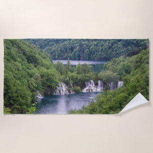 Waterfall cascade with green forest in Croatia Beach Towel