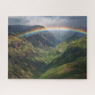 Waterfall in Lush Canyon with Rainbow on Kauai Jigsaw Puzzle