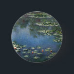 Waterlilies by Claude Monet, Vintage Flowers 6 Cm Round Badge<br><div class="desc">Water Lilies (1906) by Claude Monet is a vintage impressionism fine art landscape floral painting. It is one of many variations of water lily paintings that Monet painted in his flower garden in Giverny, France. Waterlily flowers in a spring season pond. About the artist: Claude Monet (1840-1926) was a founder...</div>