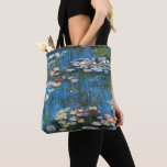 Waterlilies by Claude Monet, Vintage Impressionism Tote Bag<br><div class="desc">Beautiful all-over-print tote bags! Available in two styles and two sizes! Waterlilies (1914) by Claude Monet is a vintage impressionist fine art nature painting. One of many variations of water lily floral paintings that Monet painted by the pond in his flower garden in Giverny, France. About the artist: Claude Monet...</div>
