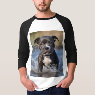 "Wave Chaser: A Staffy Puppy at Play in the Ocean" T-Shirt