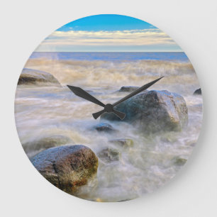 Waves crashing on shoreline rocks large clock