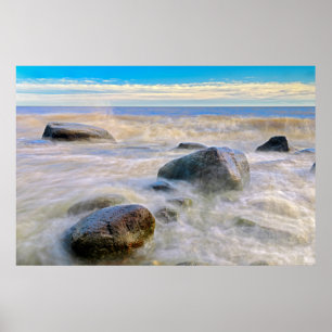 Waves crashing on shoreline rocks poster