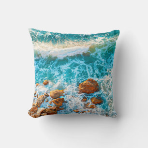 Waves on a rocky beach at sunset. Aerial viewbeach Cushion