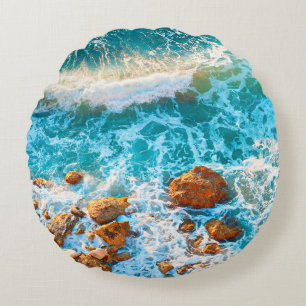 Waves on a rocky beach at sunset. Aerial viewbeach Round Cushion