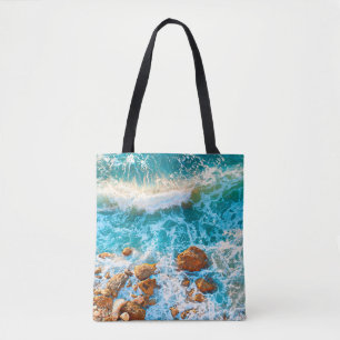 Waves on a rocky beach at sunset. Aerial viewbeach Tote Bag