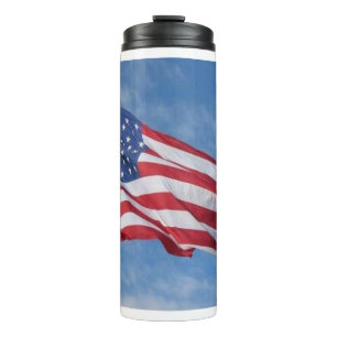 Waving American Flag Against Blue Sky Thermal Tumbler