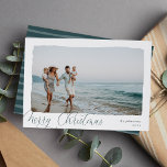 Wavy | Simple Horizontal Merry Christmas Photo Holiday Card<br><div class="desc">Elegant and understated holiday photo card frames a single horizontal or landscape-orientated photo with a wavy deckled edge border, on a crisp white background. "Merry Christmas" appears at the lower left in modern calligraphy script, with your family name and the year at the right. A simple and chic choice for...</div>