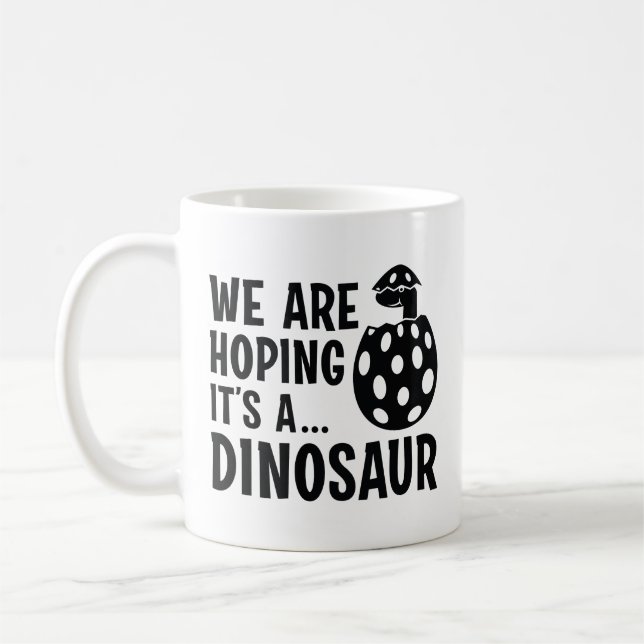We Are Hoping It’s A Dinosaur Coffee Mug (Left)