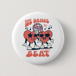 we dance to the same beat 6 cm round badge