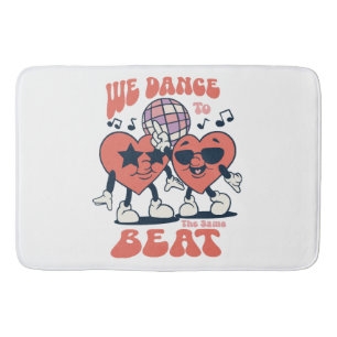 we dance to the same beat bath mat