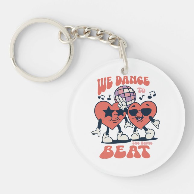 we dance to the same beat key ring (Front)
