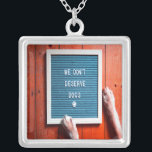 We don't deserve dogs, Animal LOVER Silver Plated Necklace<br><div class="desc">We Don't Deserve Dogs
Perfect for the animal lover in your life.  With simple text and cute dog paws on a wood floor backdrop.</div>