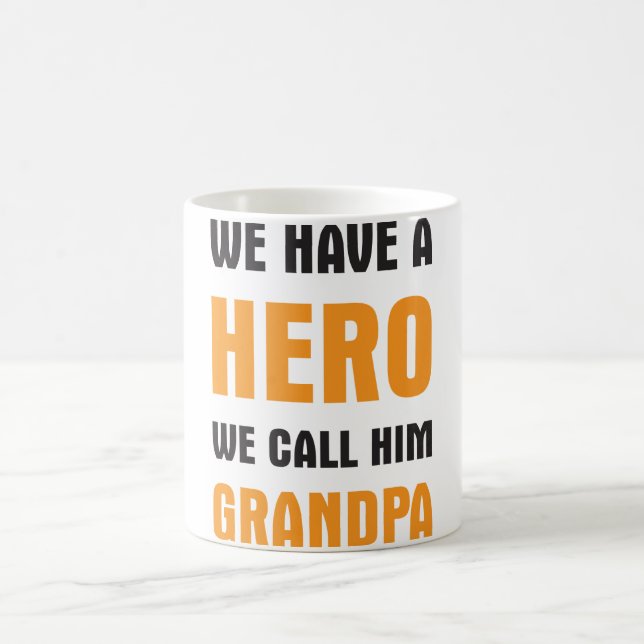 WE HAVE A HERO WE CALL HIM GRANDPA COFFEE MUG (Center)