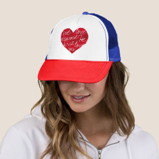 We Love Because He First Red Blue Trucker Hat