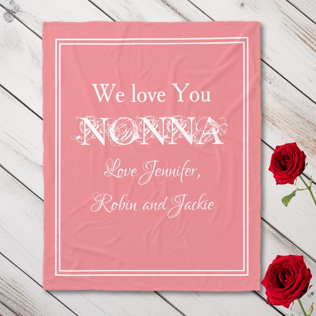 "We Love You NONNA" Personalised Names Salmon Fleece Blanket ("We Love You NONNA" Personalized Names, White Script on Salmon Fleece Blanket.)