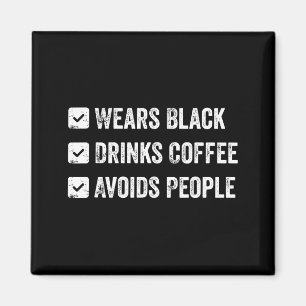 Wears black drinks coffee avoids people magnet