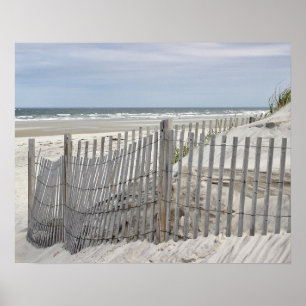 Weathered beach fence and ocean beach poster