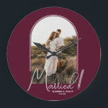 Wedding Arch Photo Burgundy Large Clock<br><div class="desc">A special keepsake features your wedding photo in an elegant arch design with the text "Married" in chic lettering along with your names and wedding date on a burgundy background small or large wall clock. Beautiful gift for your family and a fabulous memory to display in your own home. BACKGROUND...</div>