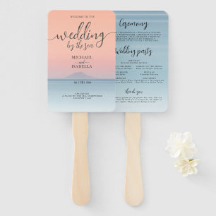 Wedding by the sea under peachy sky sunset hand fan