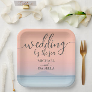 Wedding by the sea under peachy sky sunset paper plate
