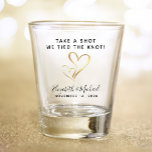 Wedding Favour Take A Shot We Tied The Knot Shot Glass<br><div class="desc">Give the your wedding guests a fun souvenir keepsake of your special day with this custom shot glass with two gold hearts together in the middle. You can personalise "Take a Shot,  We Tied the Knot" to something similar in length. Add your first names and wedding date below.</div>