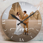 Wedding Photo Love Script Anniversary Round Clock<br><div class="desc">Celebrate love with our personalised wedding photo love script anniversary round clock,  which features an elegant script and chic modern design. This personalised photo clock beautifully displays your favourite wedding photo,  making it a timeless keepsake for newlyweds or a thoughtful wedding anniversary gift!</div>