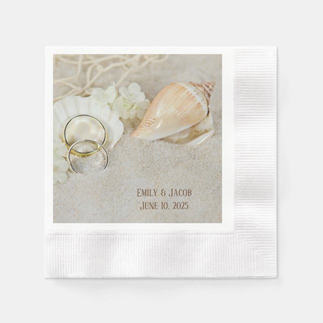 wedding rings and seashells in sand napkin (Front)