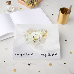 Wedding Rings in Seashell On White Satin Guest Book