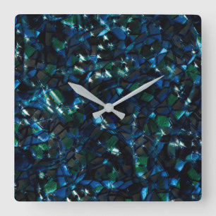 Weird mosaic over dark background and hazy sparkle square wall clock