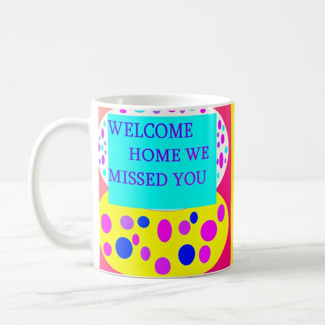 Welcome home message on  coffee mug (Left)