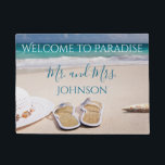 Welcome to Paradise Beach Mr and Mrs Doormat<br><div class="desc">If you love the beach, than you will love this beach sand and sea photo. Featuring a lovely beach theme "Welcome to Paradise" "Mr. and Mrs." is written beneath in blue font. Personalise your name underneath. Adjust the size of the photo and text if you increase the size of the...</div>