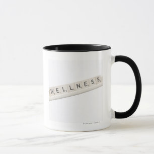 Wellness Spelled On A Word Board Game. Mug