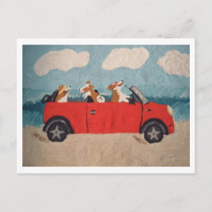 Welsh Corgis in a red convertible at the beach Holiday Postcard
