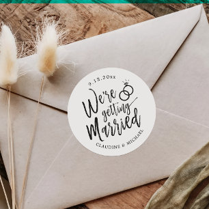 We're Getting Married Black and White Script Classic Round Sticker