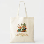 Western Boho Tote Bag<br><div class="desc">Give your girls something useful and adorable with this Last Rodeo tote bag, the perfect blend of function and flair. Featuring watercolor Western motifs—cowgirl hats, boots, and cacti—set against a soft yet bold colour palette of desert neutrals, pinks, oranges, gold, and black, it’s perfect for packing essentials or gifting goodies....</div>